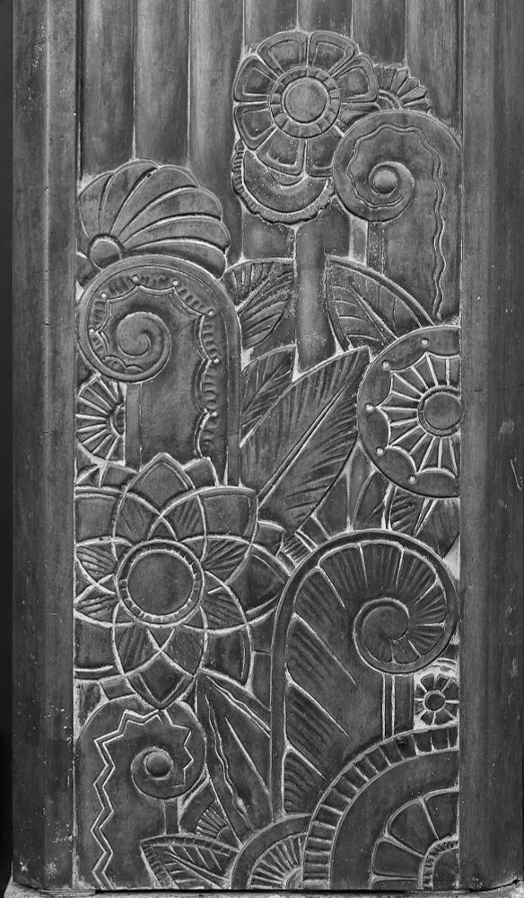 A detail of an old Horn and Hardart building on Broadway at 104th Street. It’s a metal panel, maybe copper, that has all the classic art deco features: fiddleheads, sunburst flowers, zigzags. Cool stuff. 