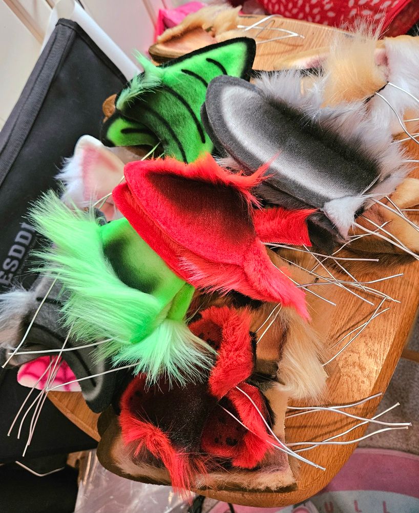 A pile of airbrushed faux fur ears