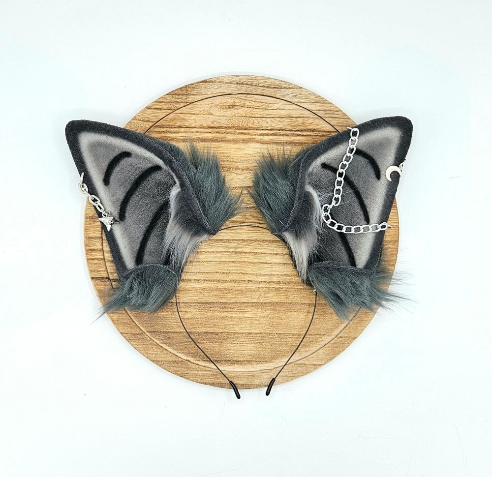 Faux fur monochrome grey bat ears with silver chains, spike chain charm, and crescent moon charm