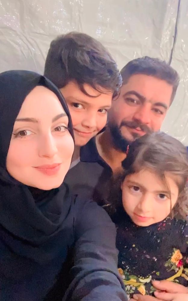 a photo of mariam's family, omar her husband and their kids yamen and rima.  not pictured is their youngest, Abed who is 2 years old now.