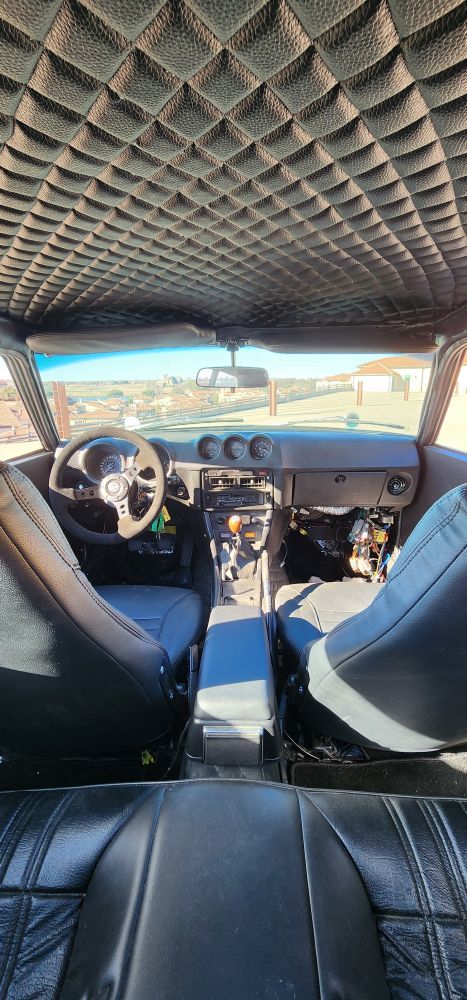 The car's interior. Ignore the wiring mess in the passenger footwell.