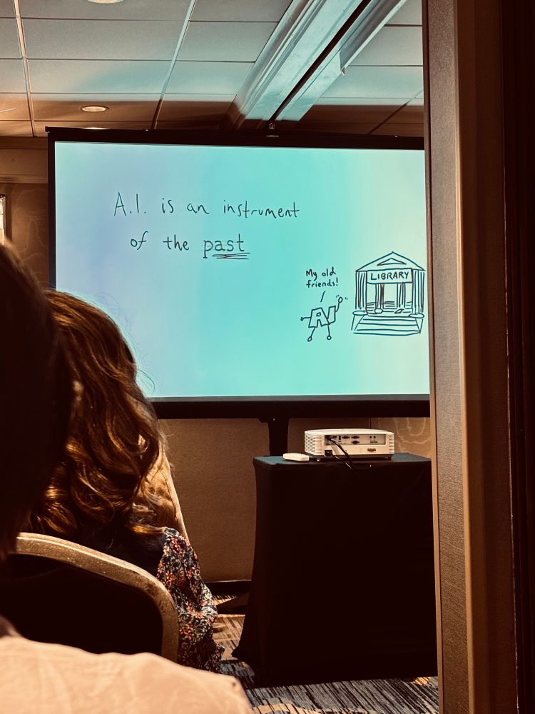 Presentation slide says “A.I. is an instrument of the past.” A drawing shows AI waving to a library saying “my old friends!”