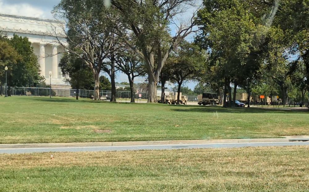 A line of National Guard vehicles next to the Lincoln Memorial