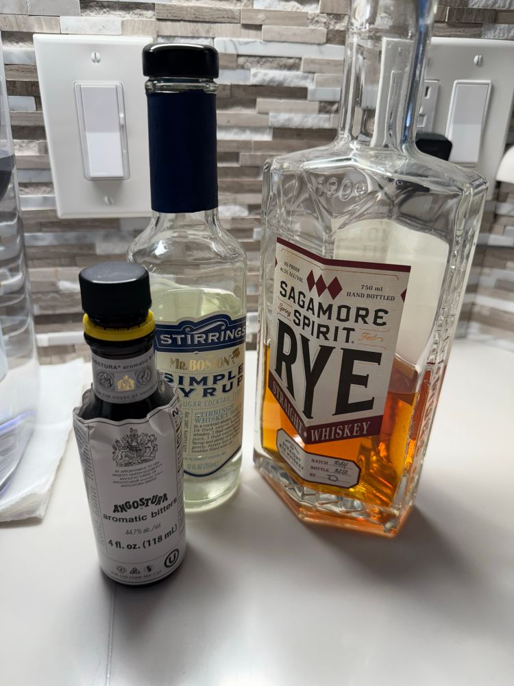 Aromatic bitters. Simple syrup, and Sagamore Spirit Rye Whiskey. The ingredients for an Old Fashioned