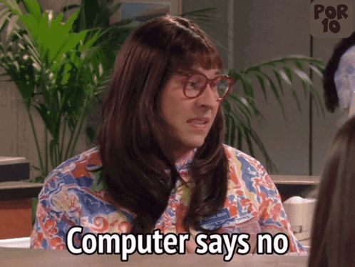 a woman says computer says no in front of a palm tree