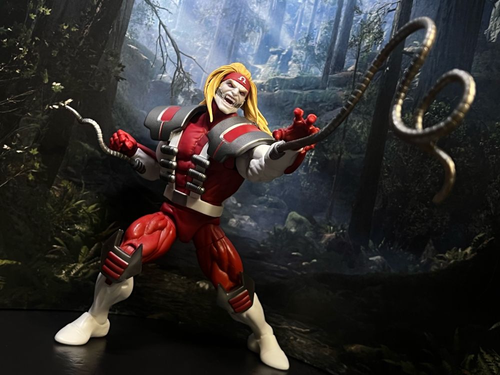 OMEGA RED! I can’t remember the build of the last one from an Amazon set. This one has pinless arms if that didn’t. Face I think is new and the digital deco makes it the best.
Knee armor and the shoulderpads/harness deal are new and more game specific. That’s nice since they could have gotten away with not doing it. I’d be dragging them here if they hadn’t because I’m insufferable.