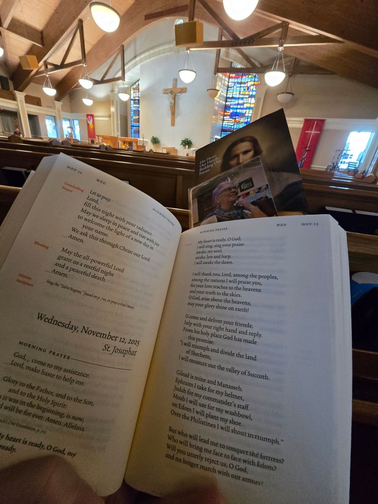 A Liturgy of the Hours prayer book open in a church. 