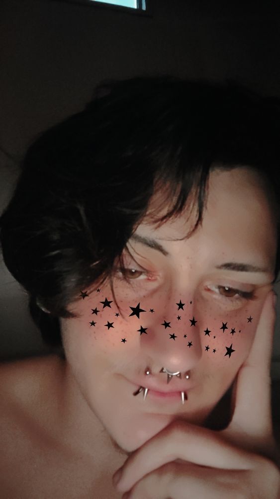 Vulpine in the bath with a filter of black stars and blush on