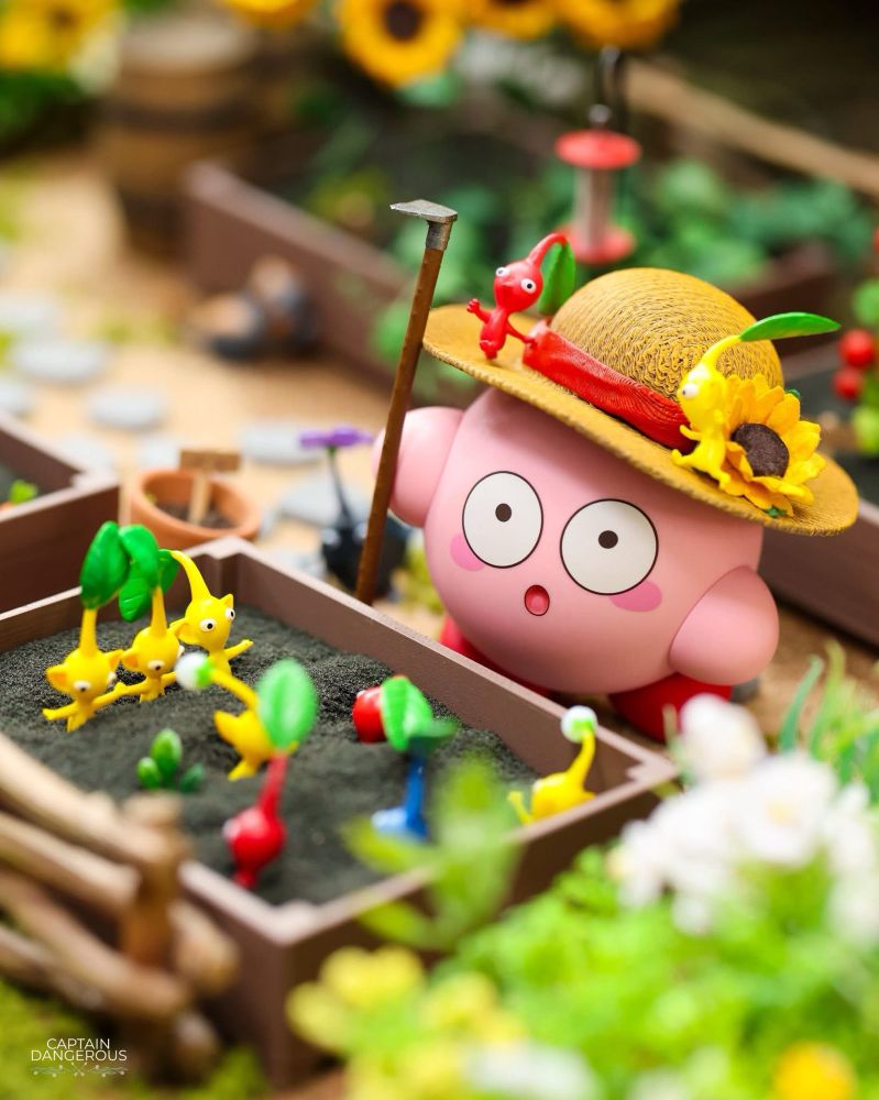 Miniature art of Kirby being surprised to find Pikmin in his garden.
