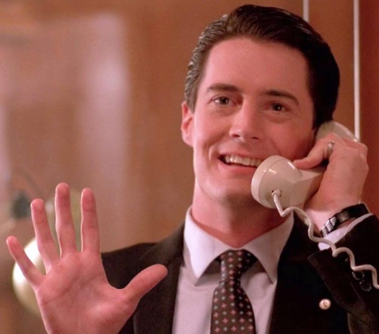 Cooper making the squeeze hand on the phone 