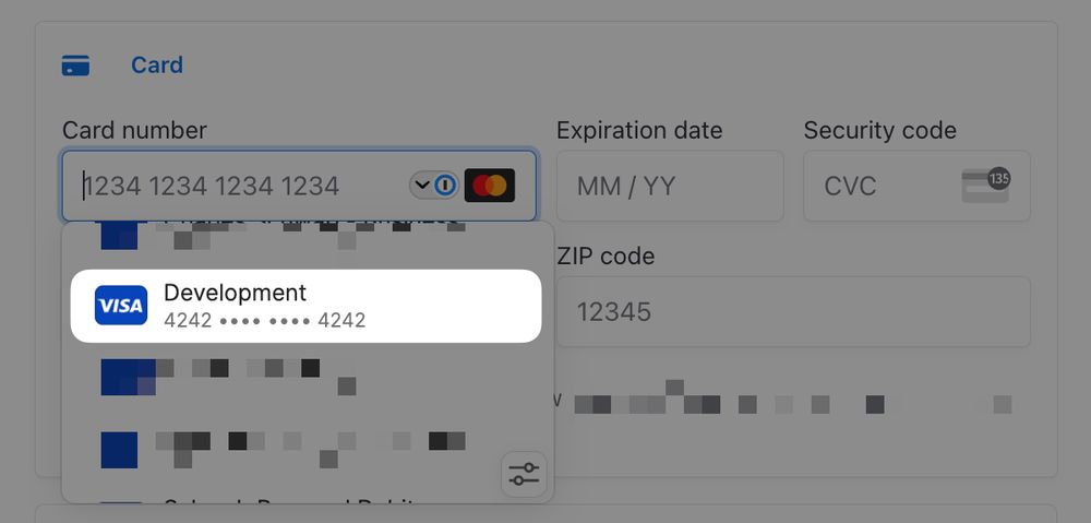 A screenshot showing a credit card autocomplete from 1Password, showing a card used for development with stripe's 4242 4242 4242 4242 test credit card number