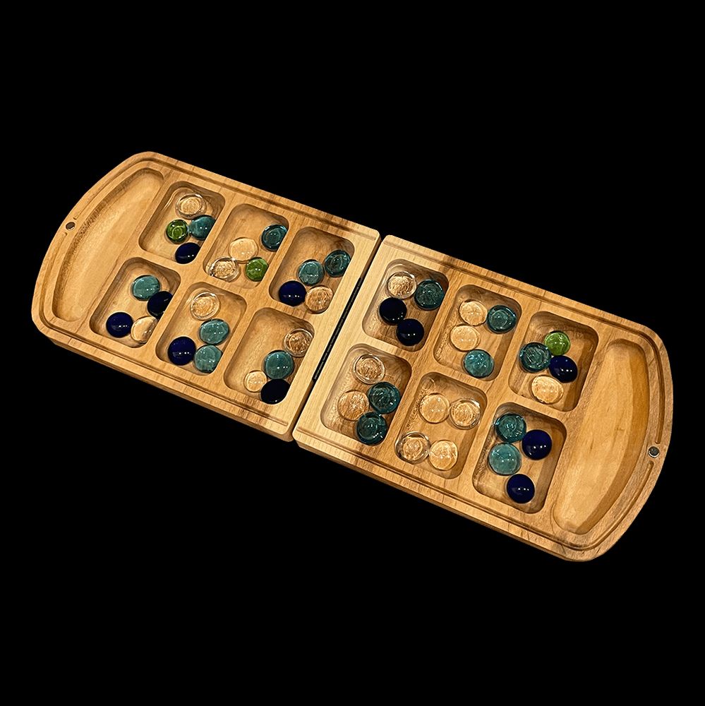 A board of mancala, evidence of a mancala-like game has been found at least in the 3rd century, but perhaps even as far back as ancient Egypt. Implications is I'm old as fuck, or lying!