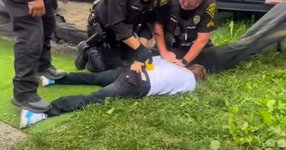 In a video of the Sunday incident, officers appear to place a man in a chokehold, tackle him, punch him and use a Taser on his back as onlookers yelled for them to stop.