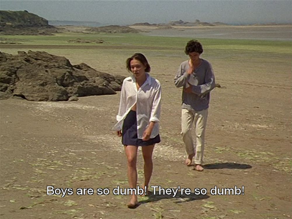 'A Summer’s Tale' (1996) 
dir. Éric Rohmer

a woman walking ahead of a man saying 

boys are so dumb! they're so dumb!