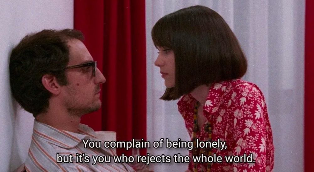 anna karina telling a guy 

you complain of being lonely, but it's you who rejects the whole world 