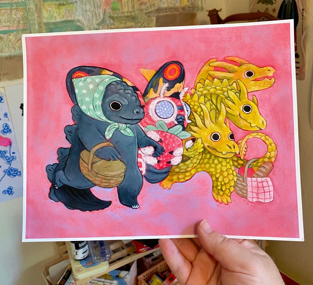 An art print of a painting of godzilla, mothra and ghidorah going for a picnic