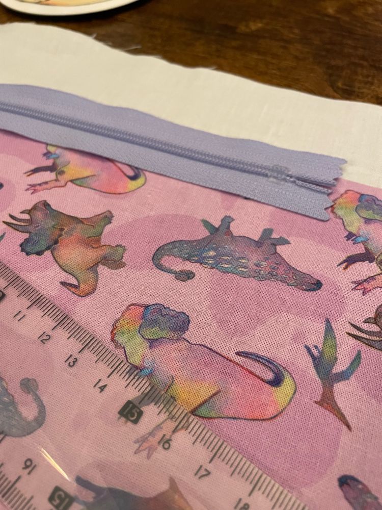 Purple and pink hand designed fabric and a light purple zip