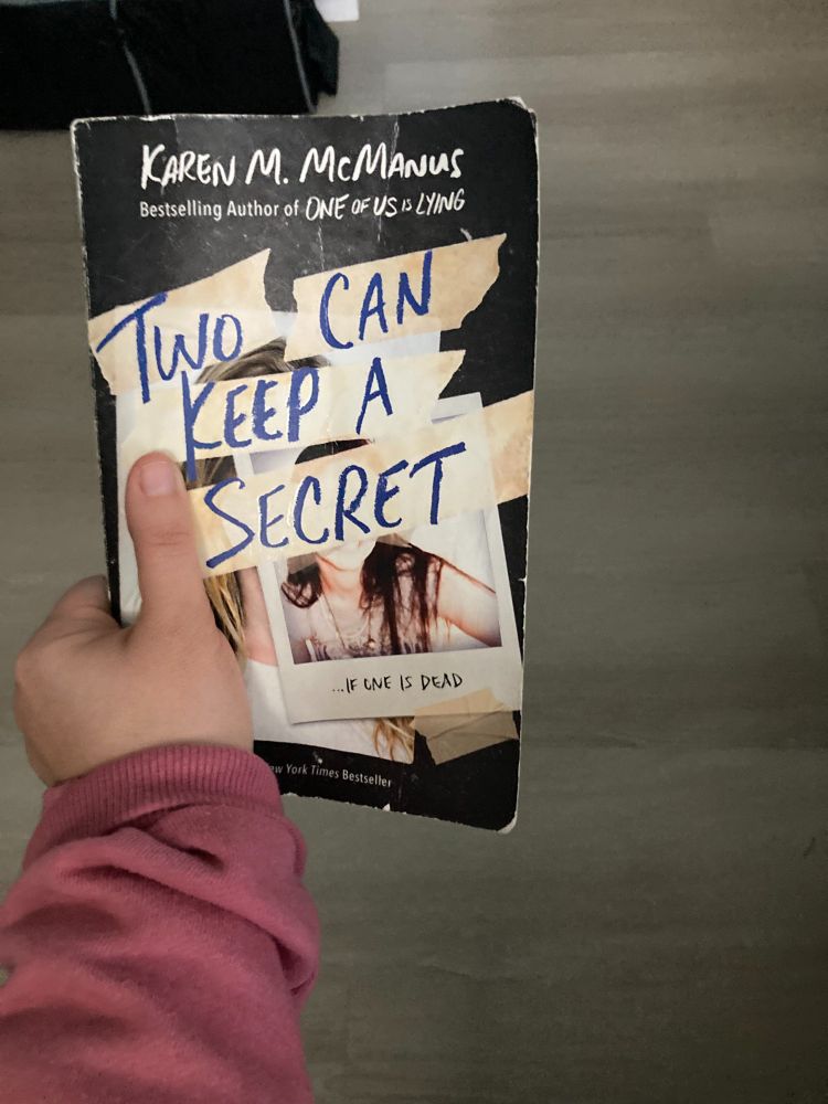 Book Cover, with title written on masking tape over polaroid photos.