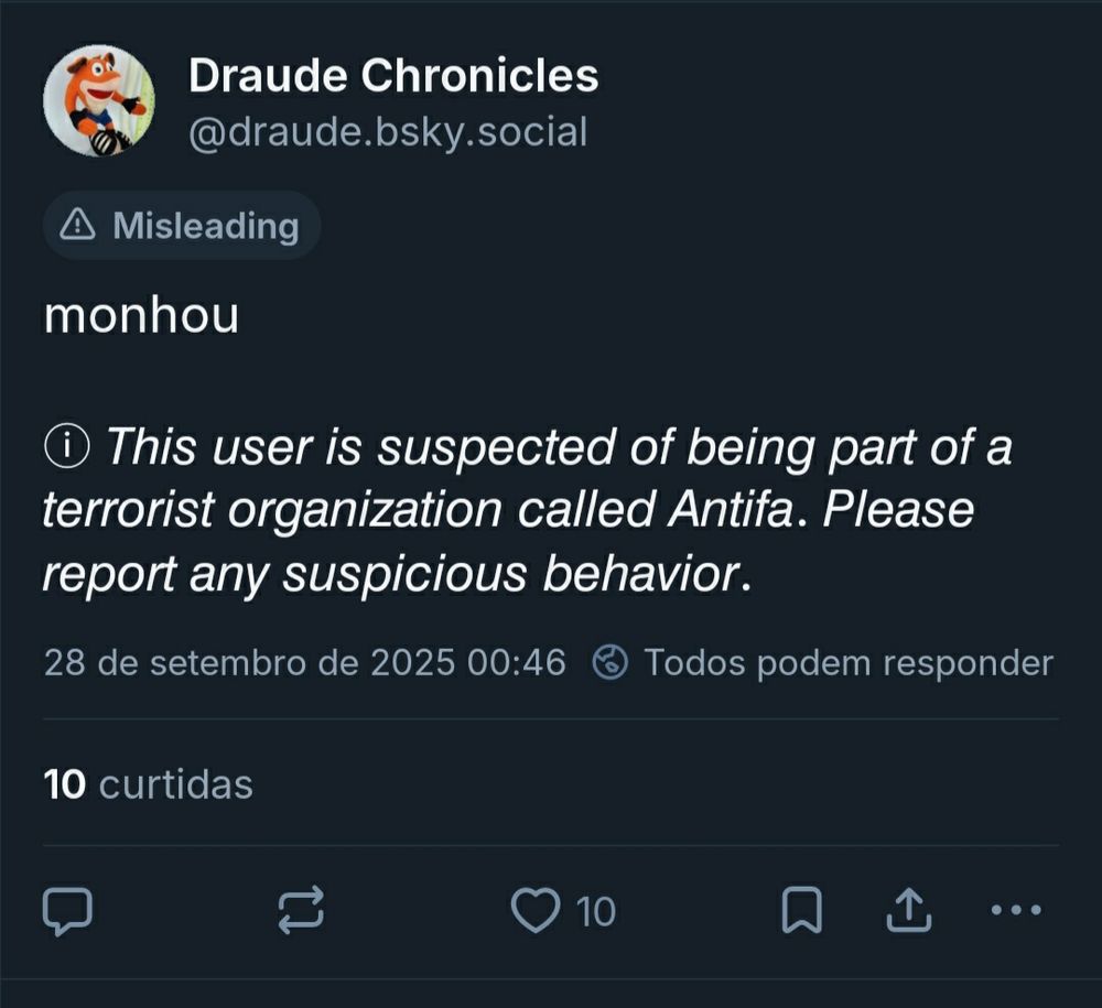 Print do post acima com os avisos "misleading" e "This user is suspected of being part of a terrorist organization called Antifa. Please report any suspicious behavior."
