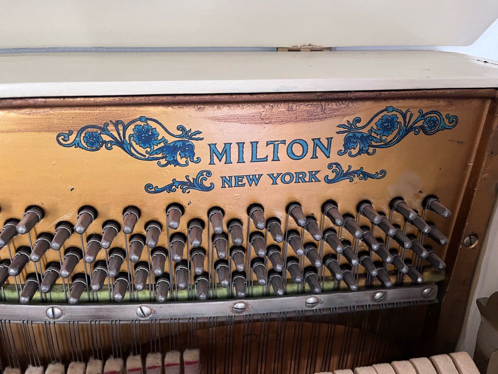 Brand name logo of old piano
