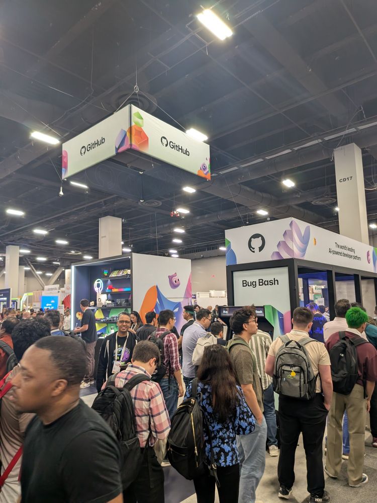 GitHub booth surrounded by hundreds of people