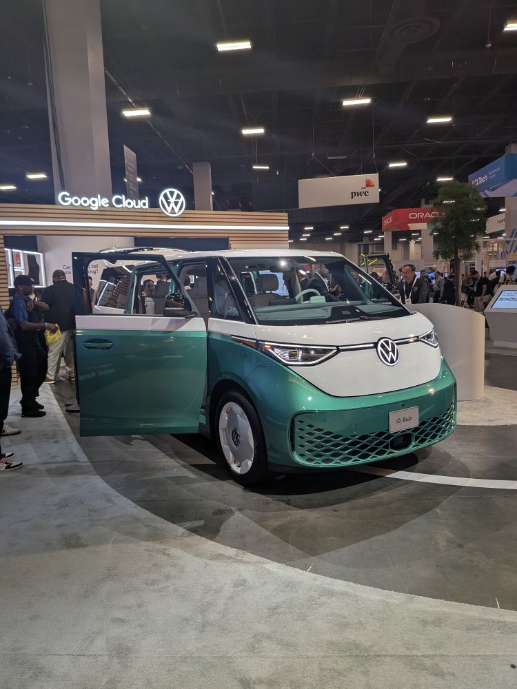 VW ID Buzz van that is half white and half green.