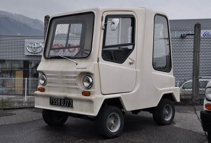 Squat little white boxy car