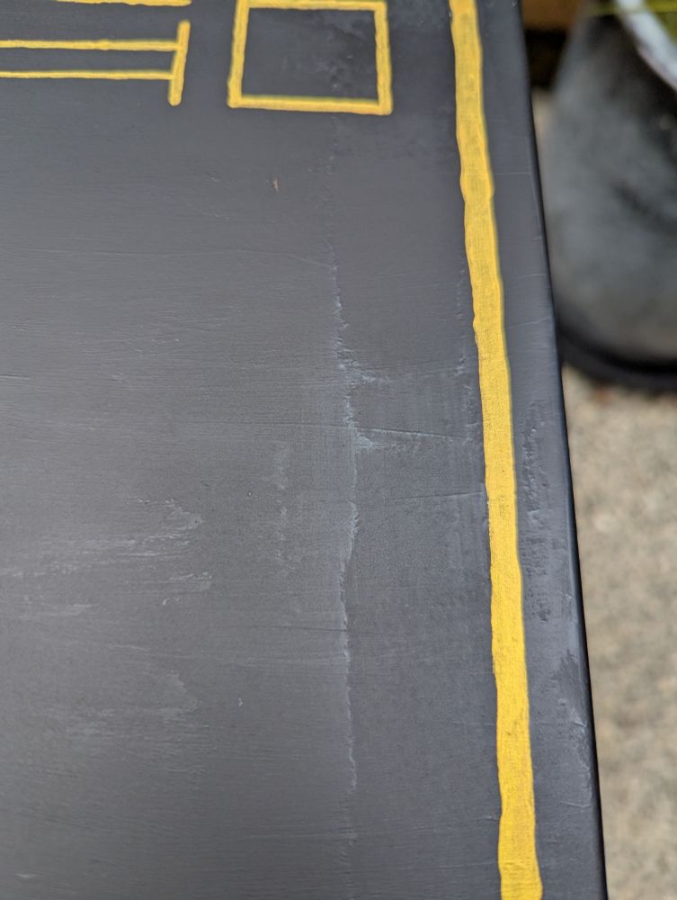 Closeup of Ikea trotten metal cart that I painted and sprayed varnish on. There's some annoying harsh edges on the varnish layer