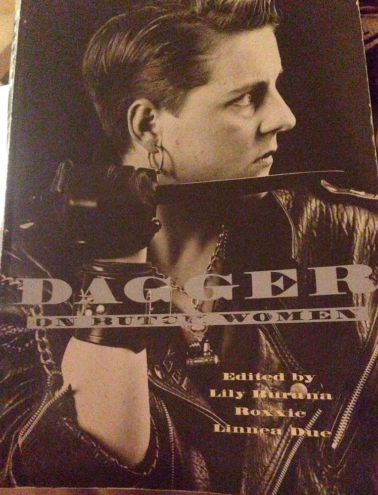 Photo of the cover of anthology Dagger: On Butch Women edited by Lily Burana and Roxxie Linnea Due. Cover image is an insanely hot butch woman in leather jacket and leather gloves holding a dagger. I think that she should kill me