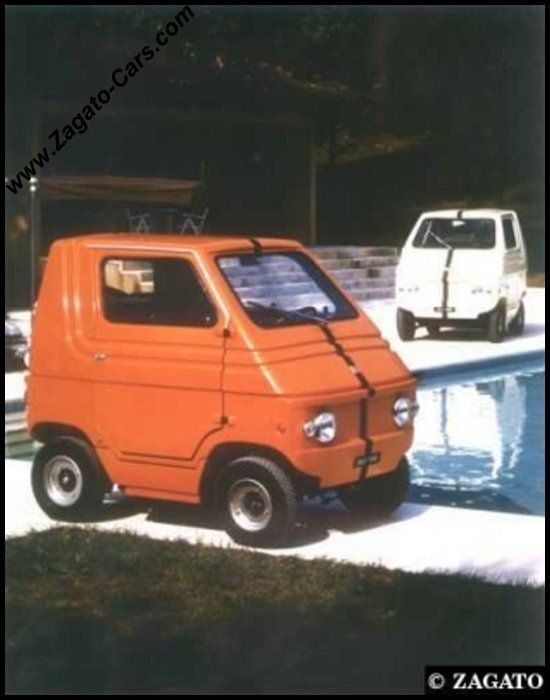 Red Zele parked by a pool with a white one further back