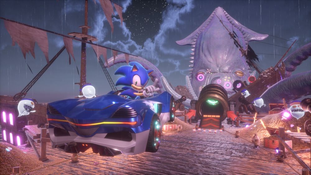 Screenshot of Sonic Racing: Crossworlds. Sonic looks backwards towards the viewer while driving his car aboard a derelict ship. He appears to be driving towards a massively menacing kraken. Keep your eyes on the road, Sonic!