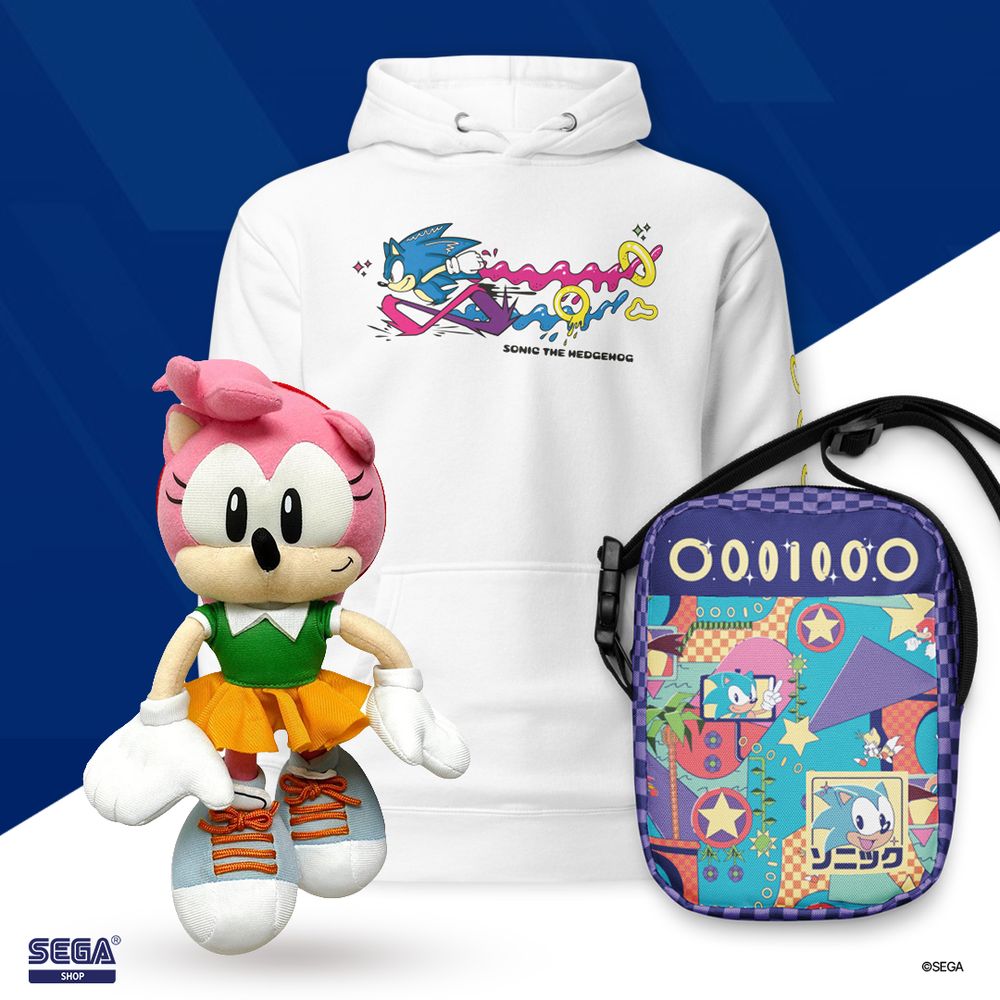 Classic Amy Rose plush. White Sonic the Hedgehog sweater. Purple Sonic the Hedgehog backpack with the words "Sonic" written in Katakana.