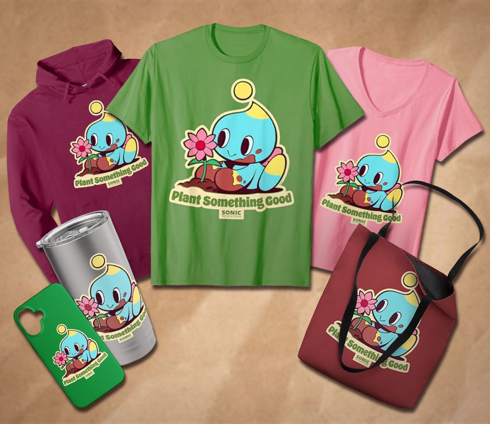 T-shirts, thermos, phone case, sweater, and tote bag with artwork of a mud-covered Chao happily planting a pink flower printed on them.