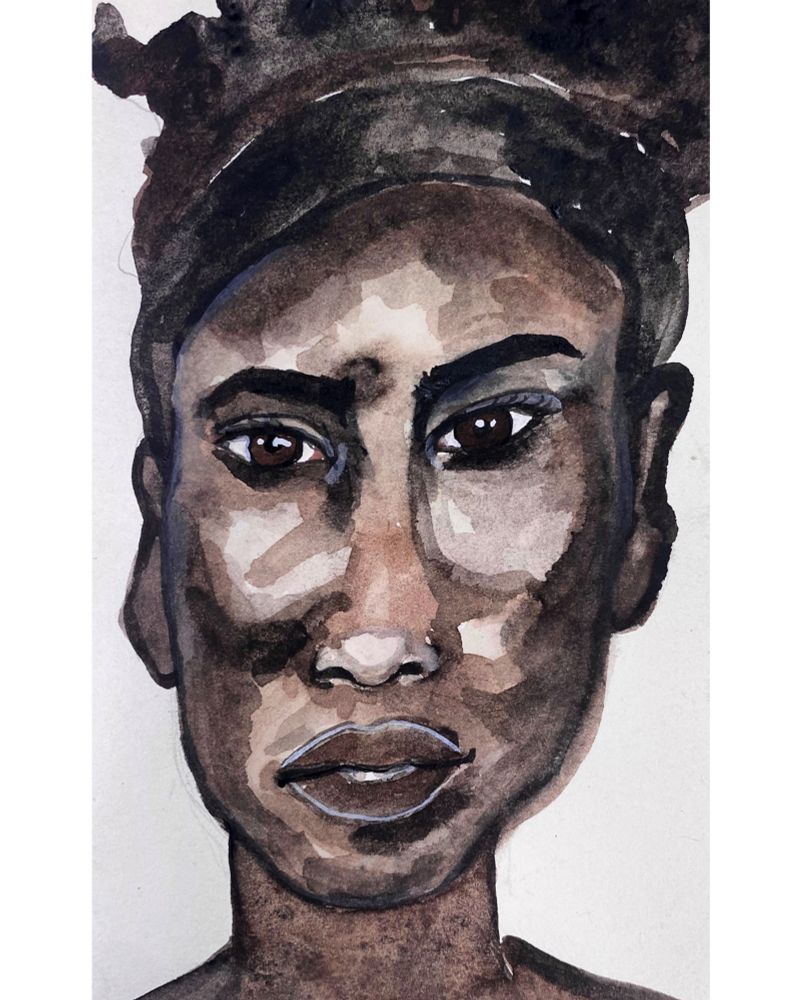 Dark skinned woman with a delicate face. A thoughtful portrait again.