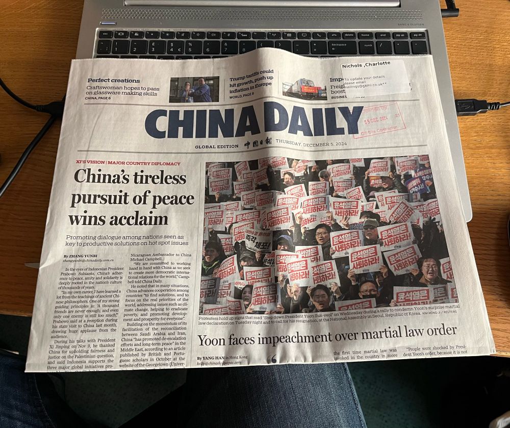 Front page of China Daily ‘newspaper’ with the headline “China’s tireless pursuit of peace wins acclaim”