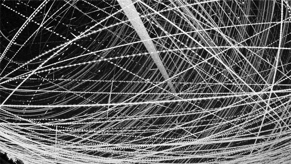 star trails, numerous aircraft trails and a wide smear across the sky caused by newly launched satellites. Behind those trails lie over a hundred meteors