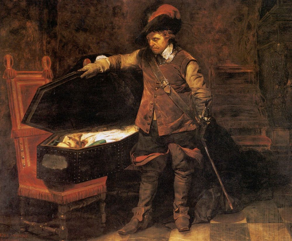 Oliver Cromwell opens the lid of Charles I's coffin.