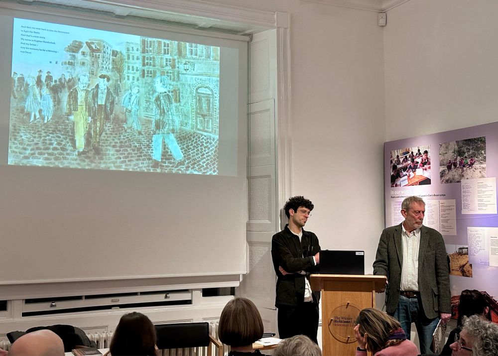 Two men standing near a lectern, slice from illustrated book