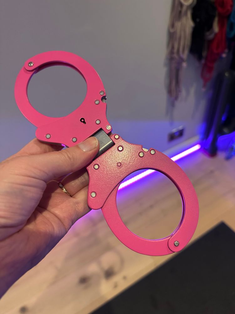 A pair of pink handcuffs