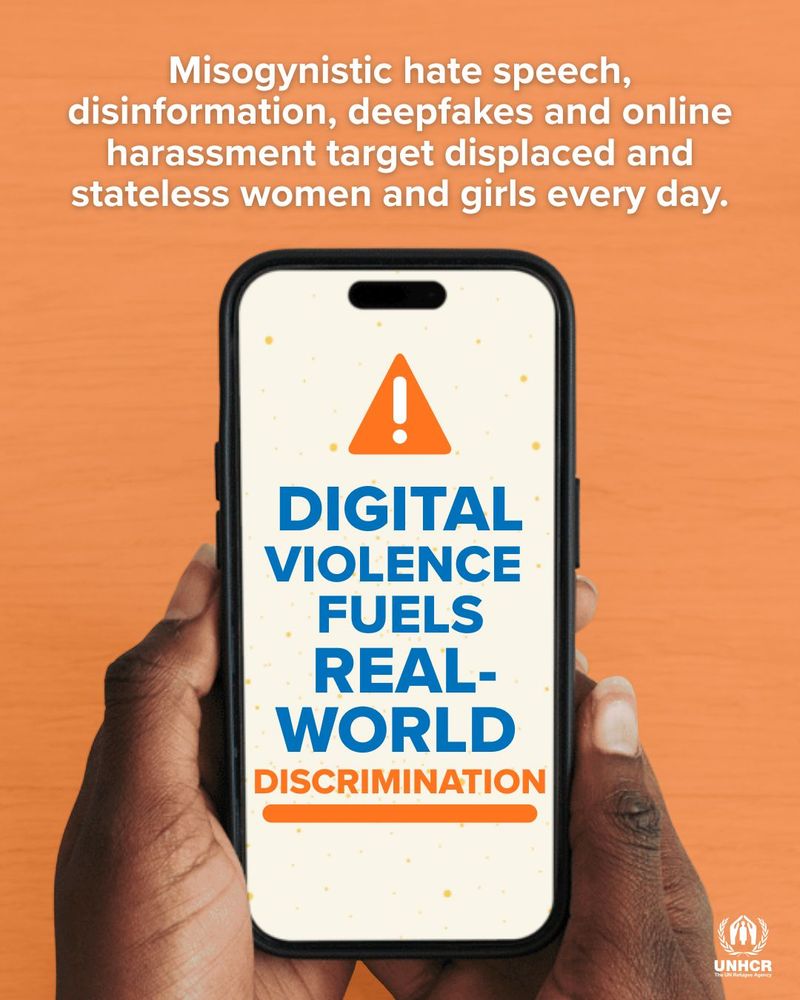 Hands holding a smartphone displaying a warning icon and the text: ‘Digital violence fuels real-world discrimination.’ Above the phone, text reads: ‘Misogynistic hate speech, disinformation, deepfakes and online harassment target displaced and stateless women and girls every day.’ UNHCR logo appears at the bottom right corner.