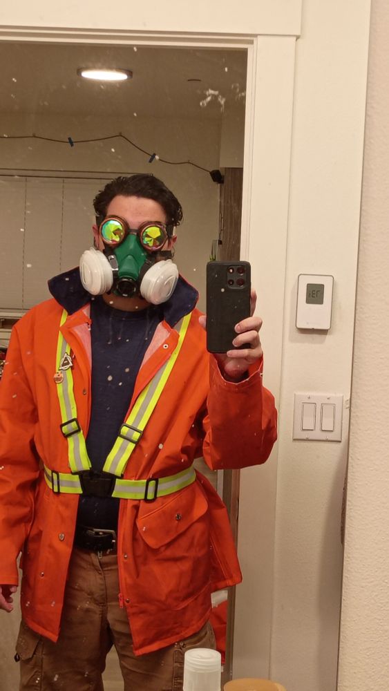 Rosa yote in hazmat jacket with hivis harness and respirator and sparkle goggles and stuff 