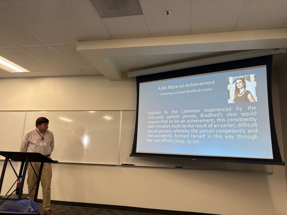 Christian is in front of a slide which makes reference to Gwen Branford’s work on achievement. 