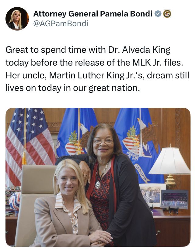 A tweet from Attorney General Pamela Bondi (@AGPamBondi) includes a photo of her seated in a leather office chair, smiling, with Dr. Alveda King standing beside her, resting a hand on Bondi’s shoulder. Both women are smiling. Behind them are American flags and Department of Justice flags, indicating a formal government office setting. A desk lamp and framed photographs are visible in the background.

The tweet text reads:
“Great to spend time with Dr. Alveda King today before the release of the MLK Jr. files. Her uncle, Martin Luther King Jr.’s, dream still lives on today in our great nation.”