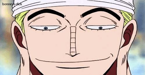 a close up of a man 's face from one piece with a bandana on his head .