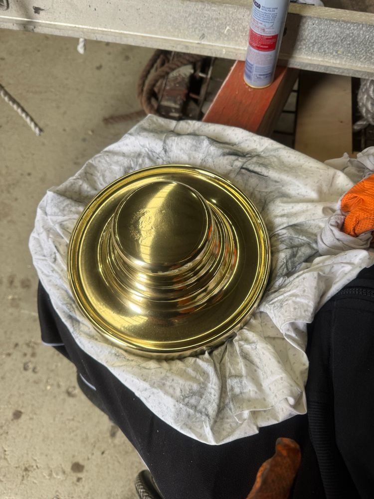 Wheel boss of tall ship with 15 years build up of grime and tarnishing