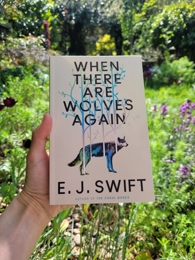 Front cover of proof copy of WHEN THERE ARE WOLVES AGAIN by E. J. Swift featuring a wolf, foliage and flowers design 