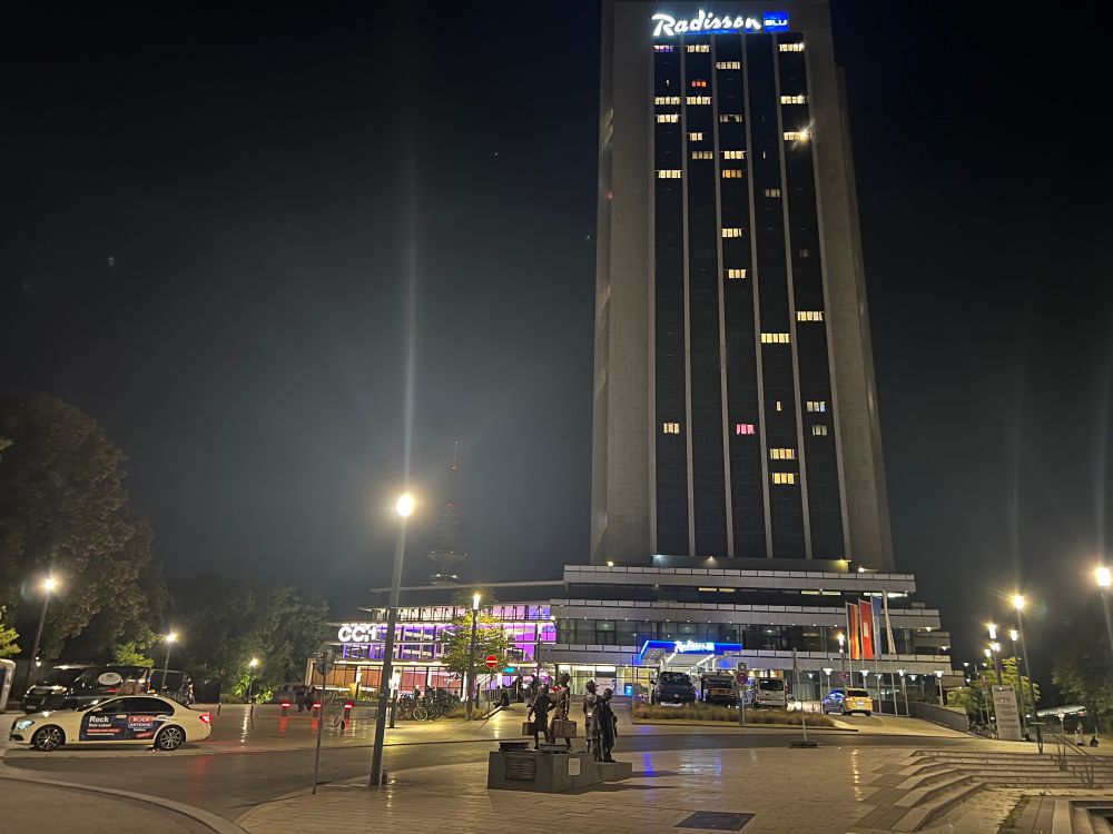 a picture of the CCH and Radisson at night viewed from the Dammtor station entrance/exit