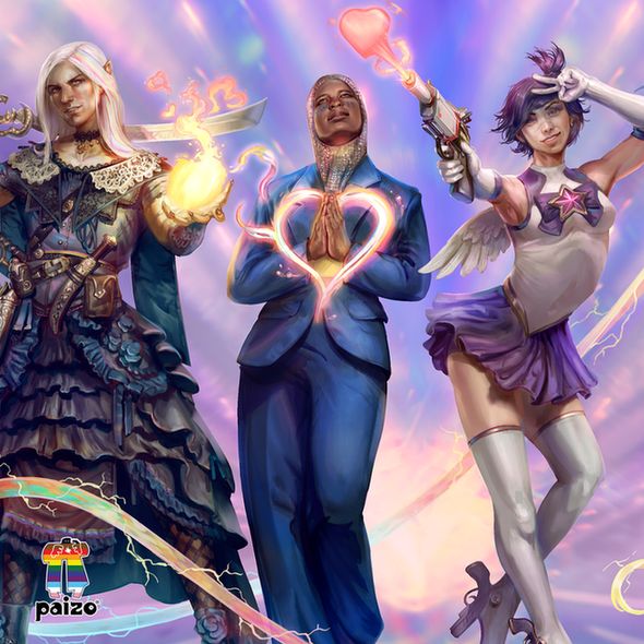 Seltyiel, the Pathfinder iconic aiuvarin magus, Kyra, the Pathfinder iconic human cleric, and Navasi, the Starfinder iconic human envoy, stand fierce and proud next to each other in a line, Seltyiel in a dress and a ball of fire in his hand, Kyra, in a well tailored blue suit with a heart of light around her hands, and Navasi dressed as a sailor scout shooting a love gun. In the bottom left corner of the image is the "Paizo" Pride logo.