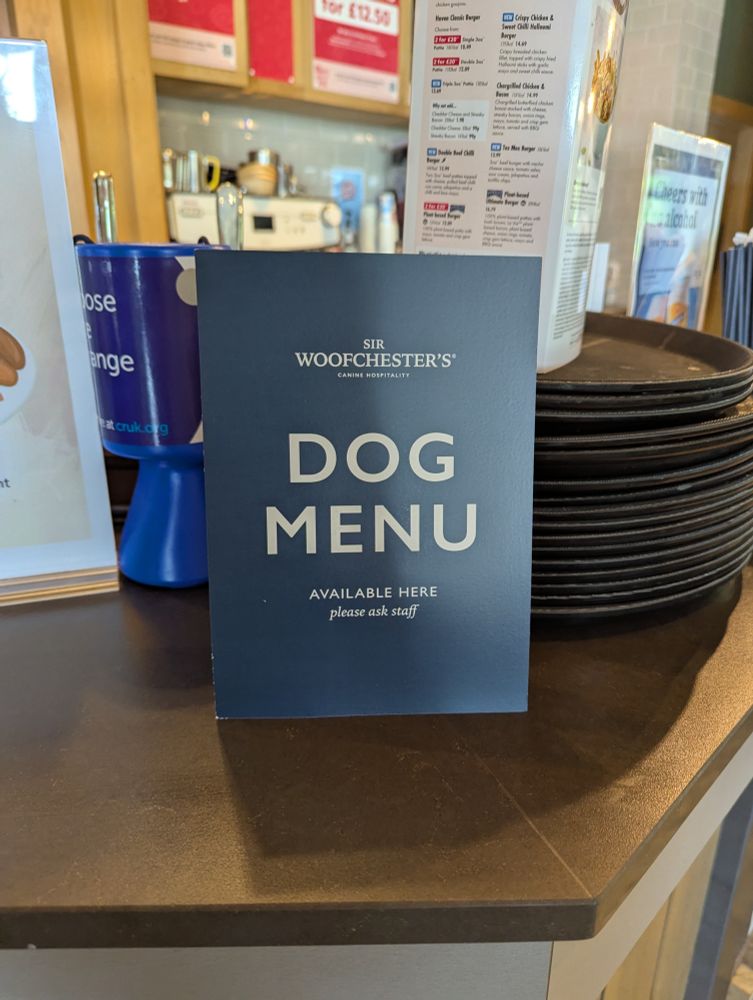 Sign on the bar which reads 'Dog Menu'
