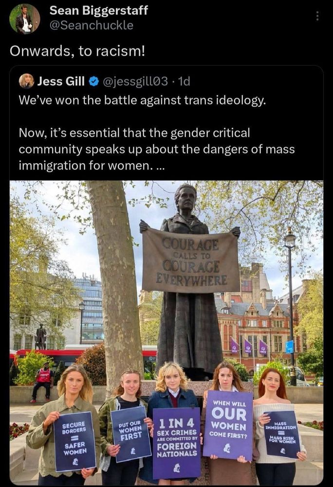 Transphobes in parliament square holding grim signs saying that women are at risk from immigrants / foreign nationals. 